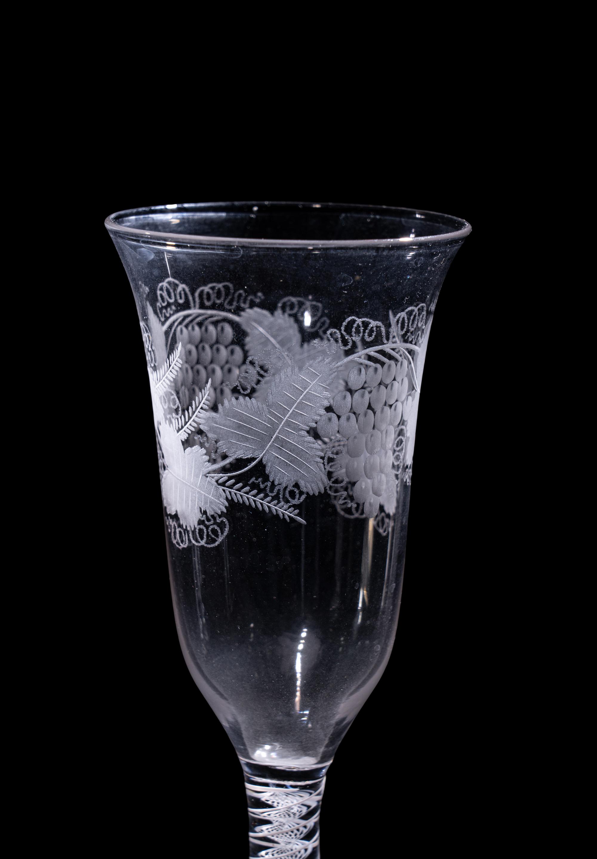 A Set of Seven Engraved Glass Cordials with Twist Stems