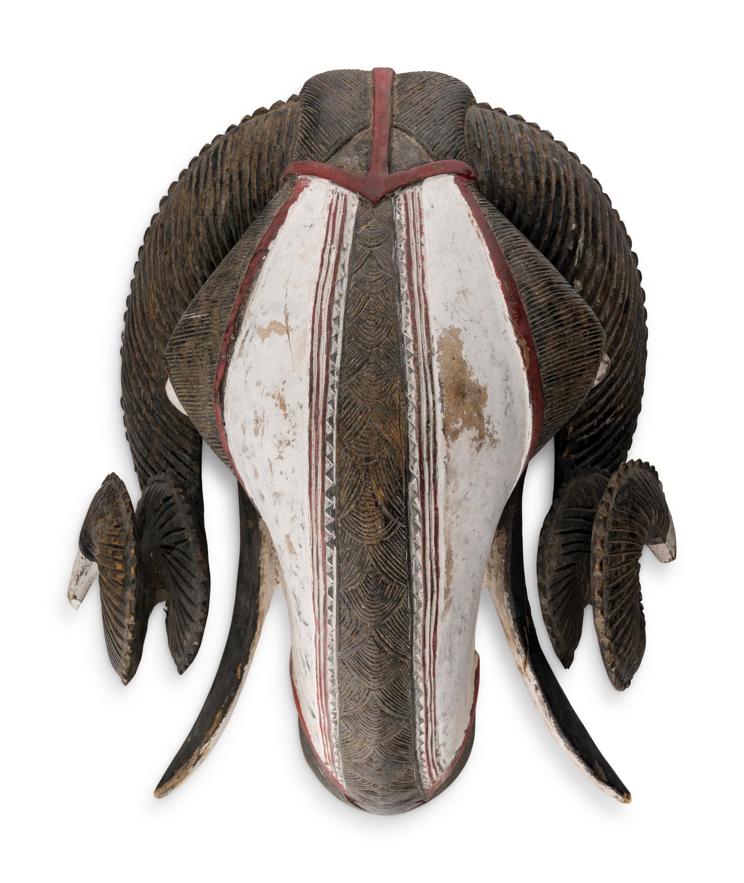An African Carved and Painted Wood Ram's Head