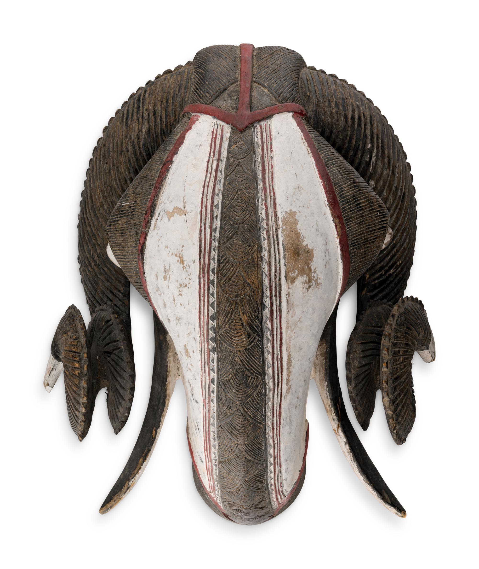 An African Carved and Painted Wood Ram's Head