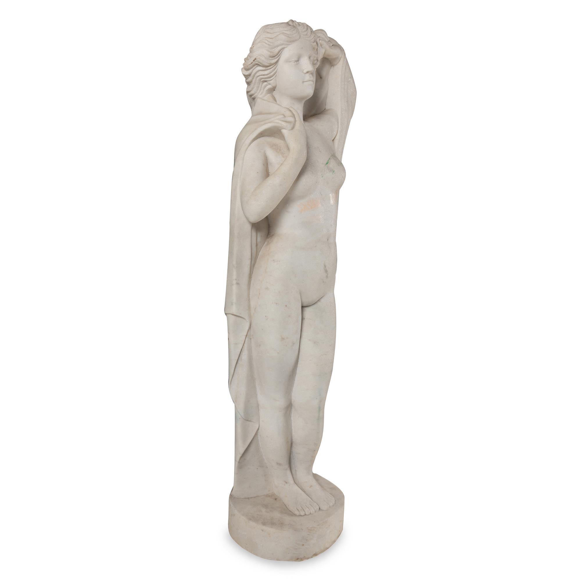 A Carved Marble Figure of a Maiden