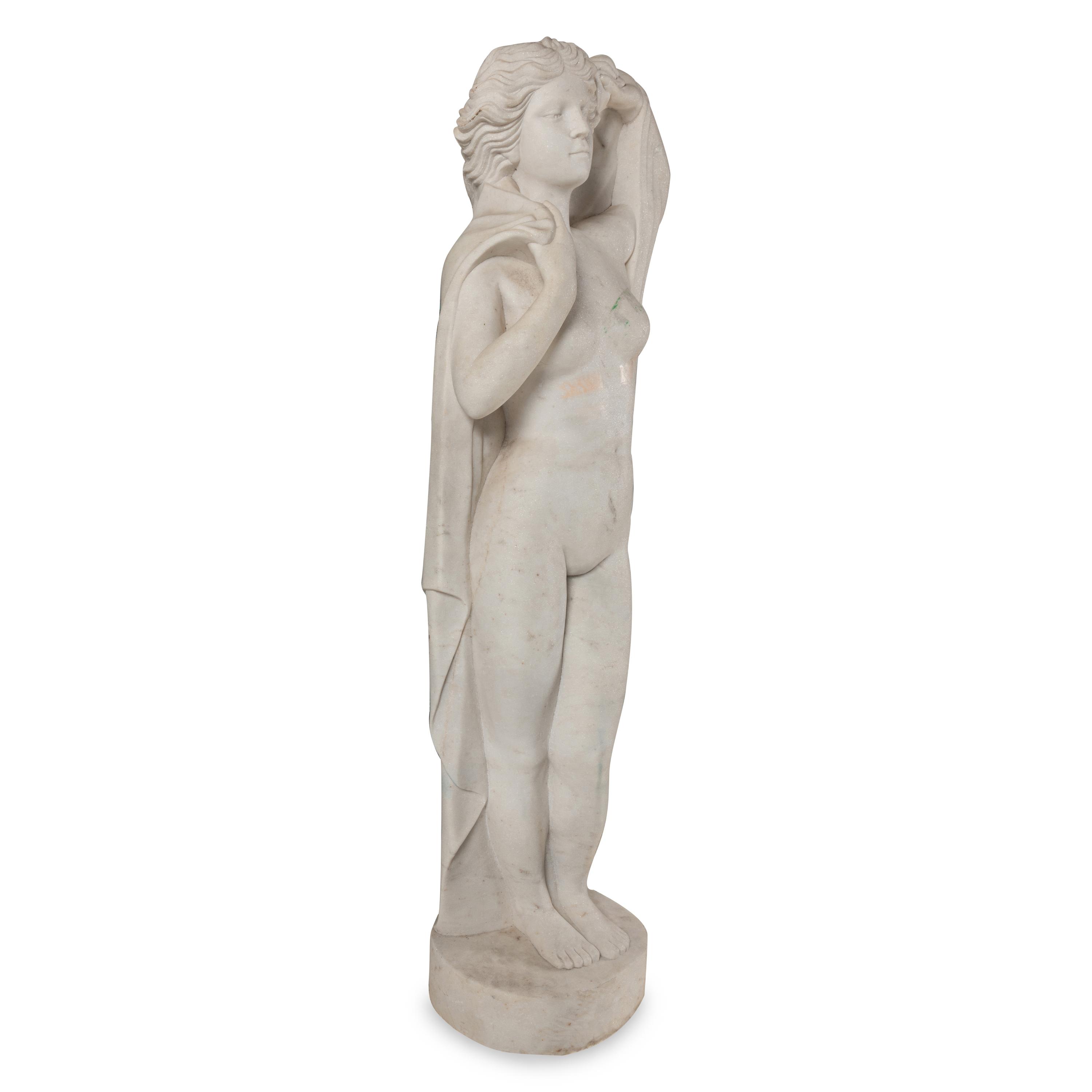 A Carved Marble Figure of a Maiden