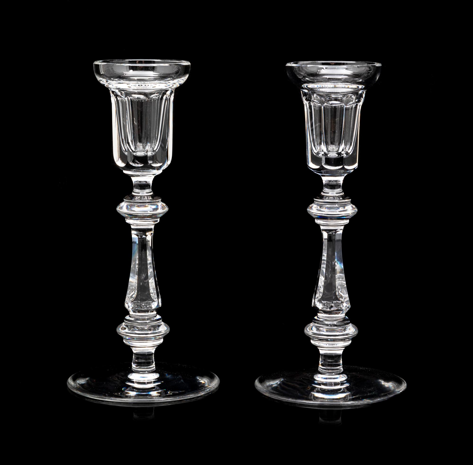 A Pair of Waterford Candlesticks Height 8 1/4 inches.