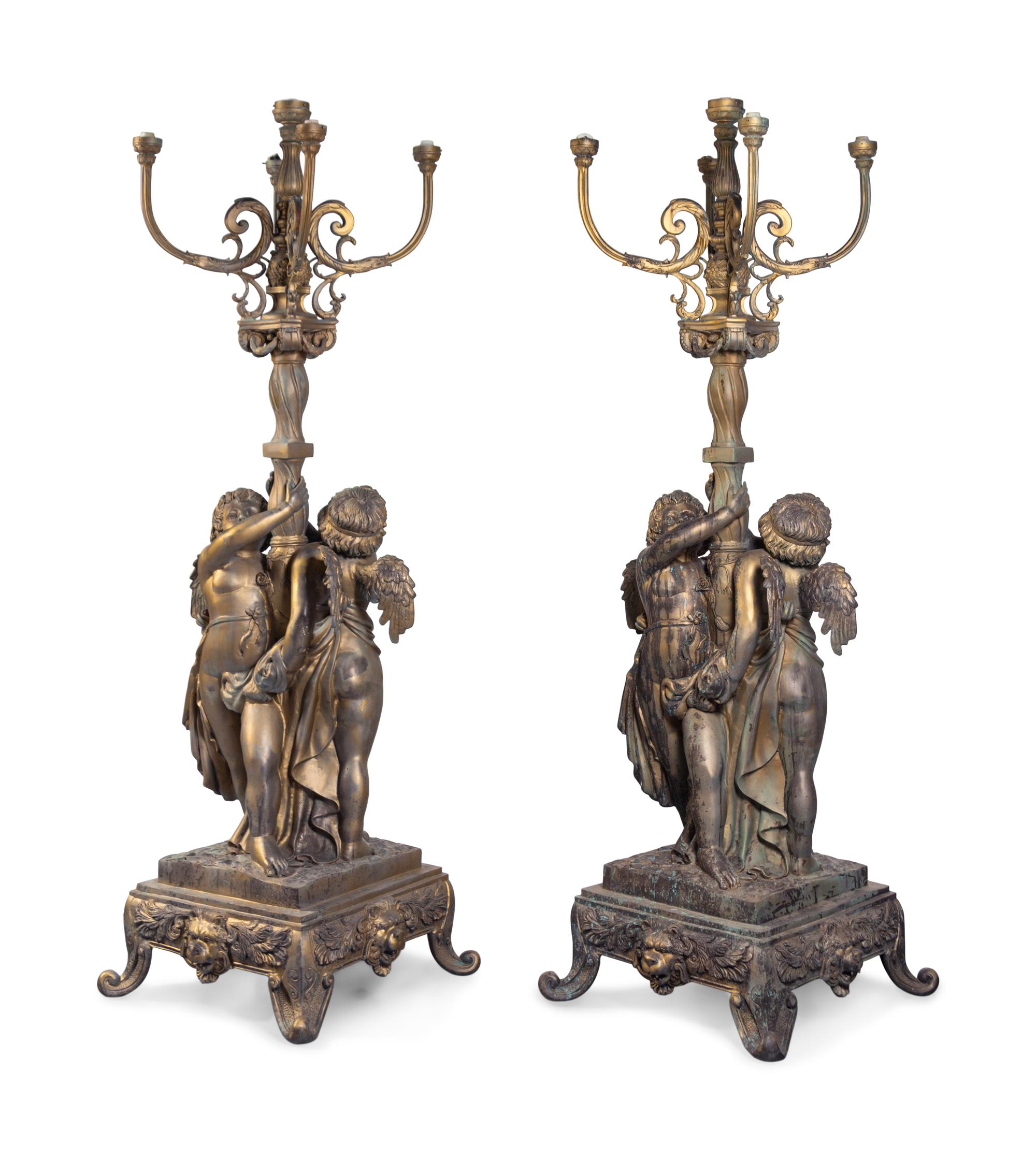 A Pair of Neoclassical Style Parcel Gilt Cast Metal Five-Light Torchères