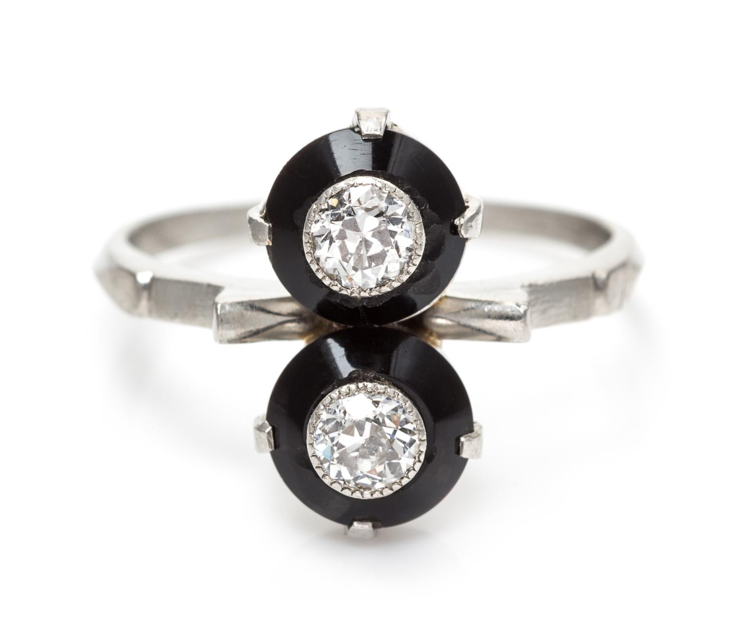 An Art Deco Platinum, Onyx and Diamond Toi et Moi Ring, 3.40 dwts.