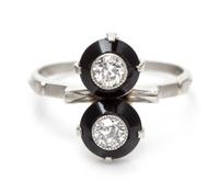 An Art Deco Platinum, Onyx and Diamond Toi et Moi Ring, 3.40 dwts.