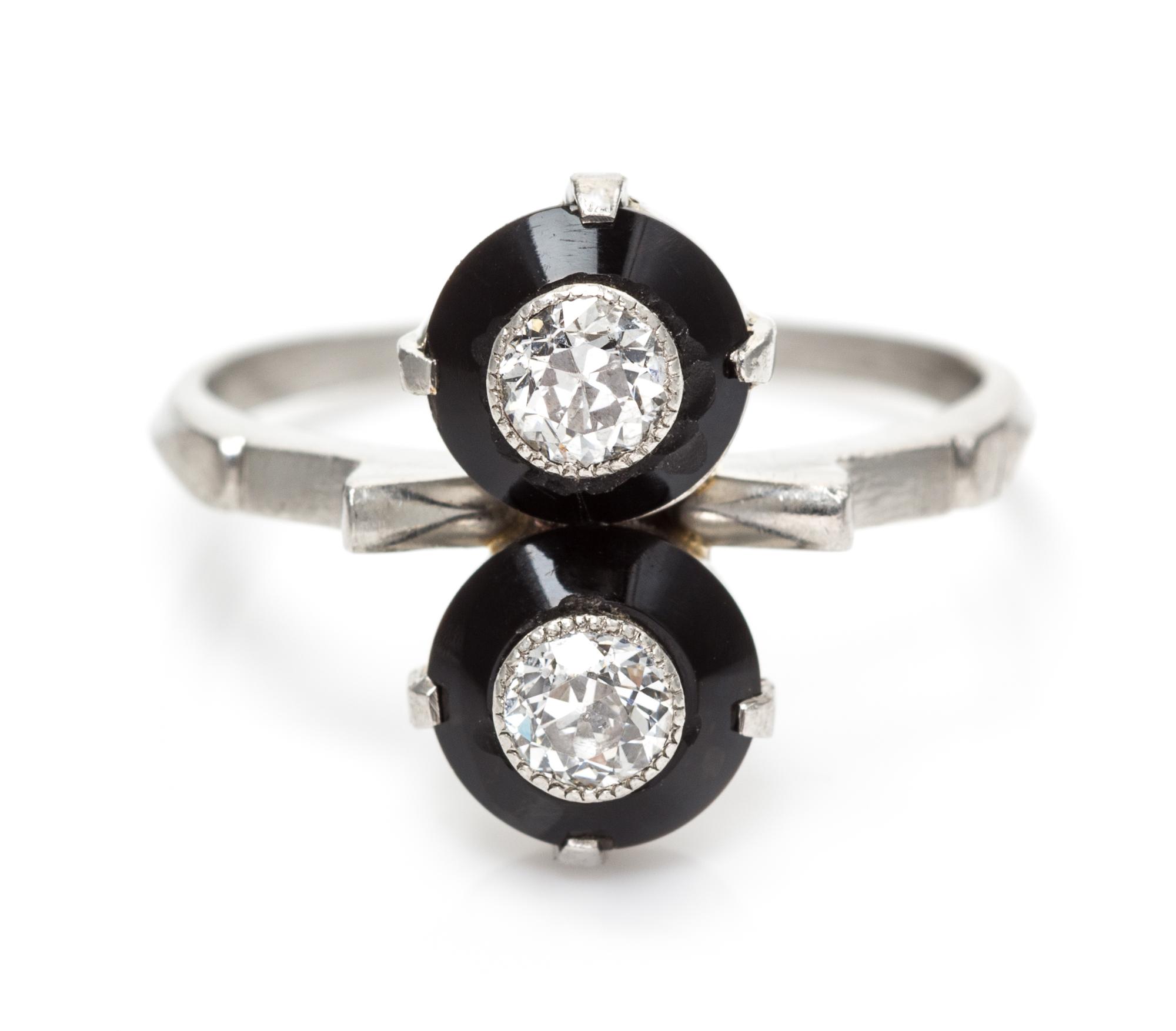 An Art Deco Platinum, Onyx and Diamond Toi et Moi Ring, 3.40 dwts.