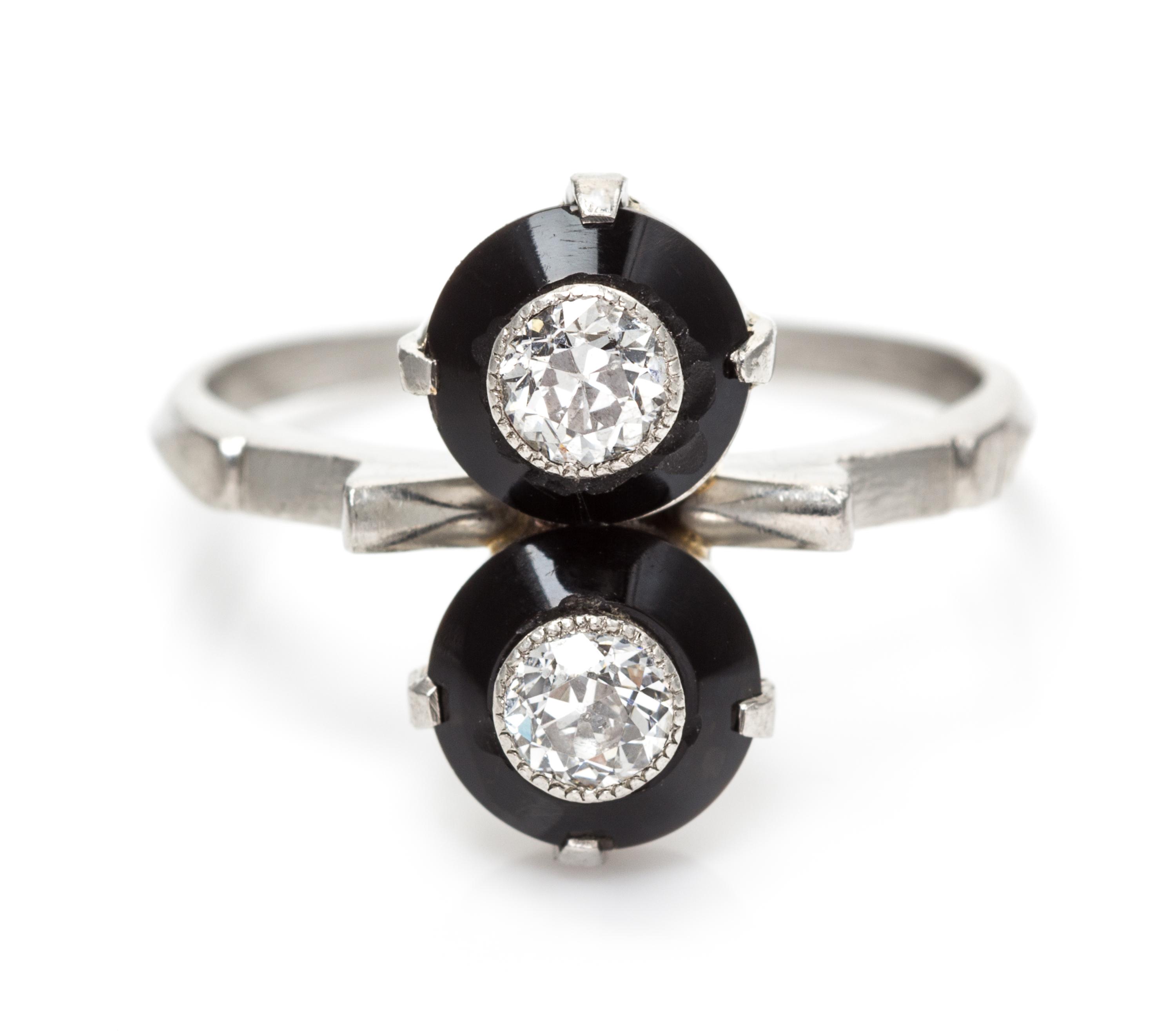 An Art Deco Platinum, Onyx and Diamond Toi et Moi Ring, 3.40 dwts.