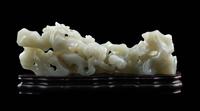 A Chinese Pale Celadon Jade ‘Lingzhi and Rockwork’ Brush Rest, 20th Century — 近代 青白玉靈芝筆架