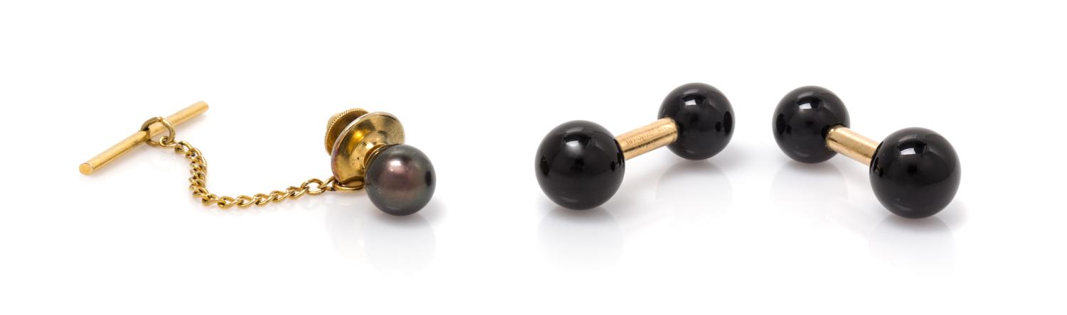 A Pair of 14 Karat Yellow Gold and Onyx Cufflinks, Tiffany & Co., 7.50 dwts.