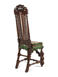 A Pair of William and Mary Style Carved Walnut Side Chairs