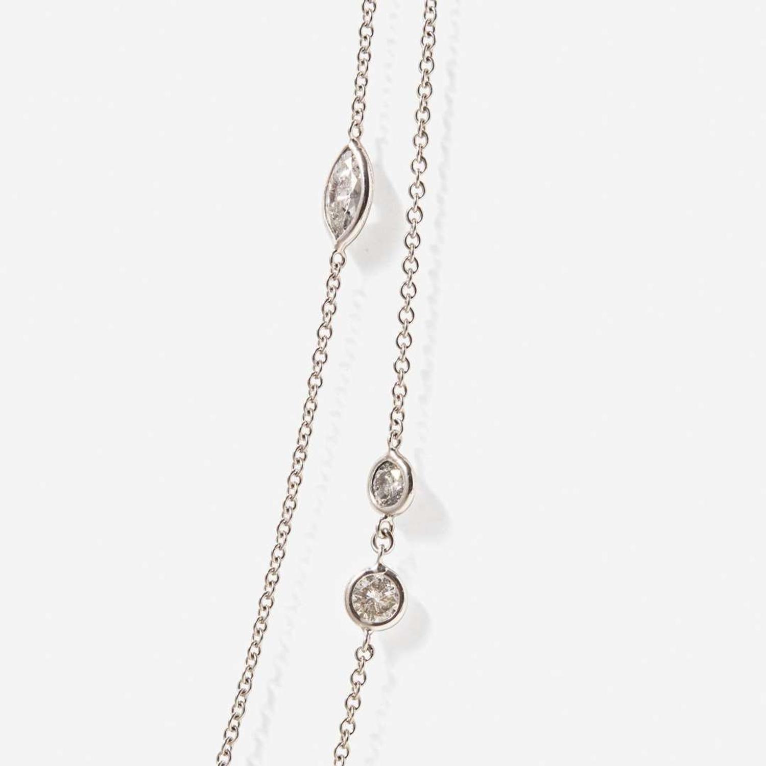 An 18K White Gold and Diamond Station Necklace