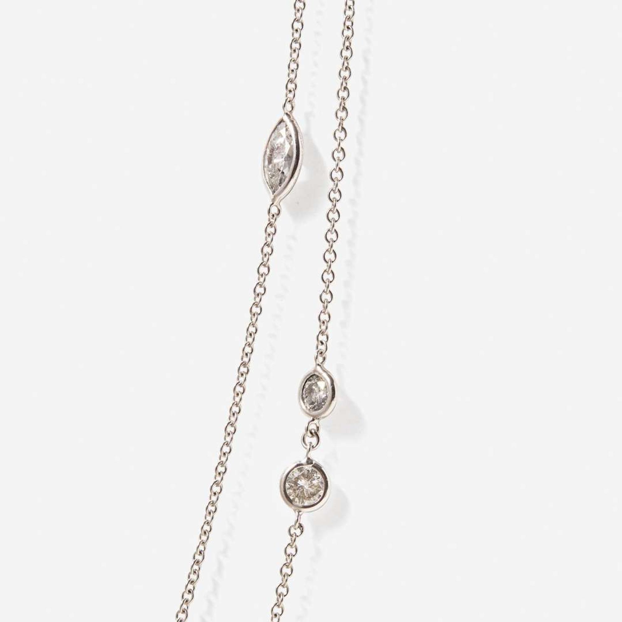 An 18K White Gold and Diamond Station Necklace