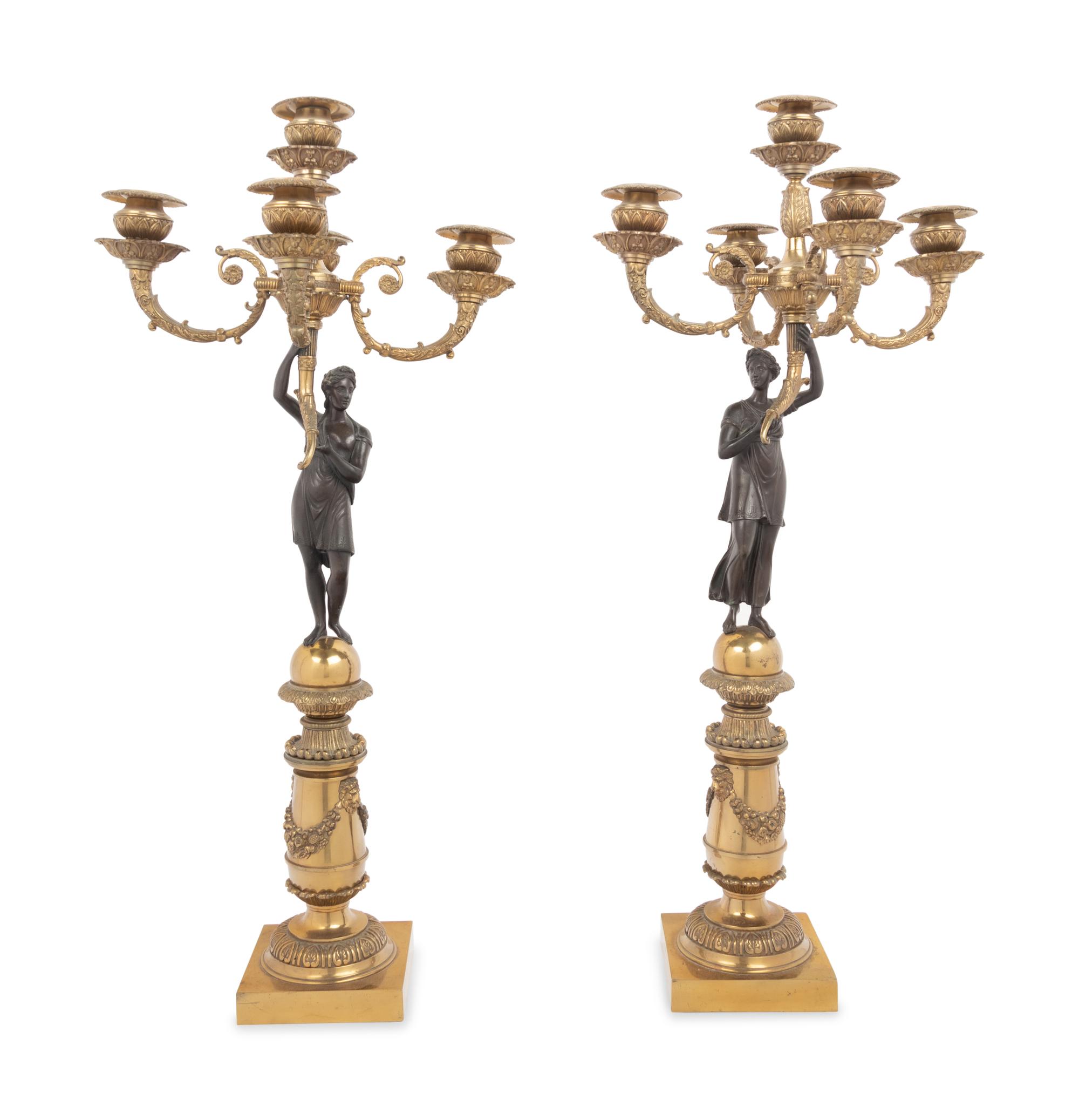 A Pair of Empire Style Gilt and Patinated Bronze Figural Five-Light Candelabra