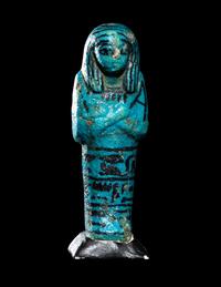 An Egyptian Blue Faience Ushabti for the Mistress of the House and Chantress of Amun, Muthotep