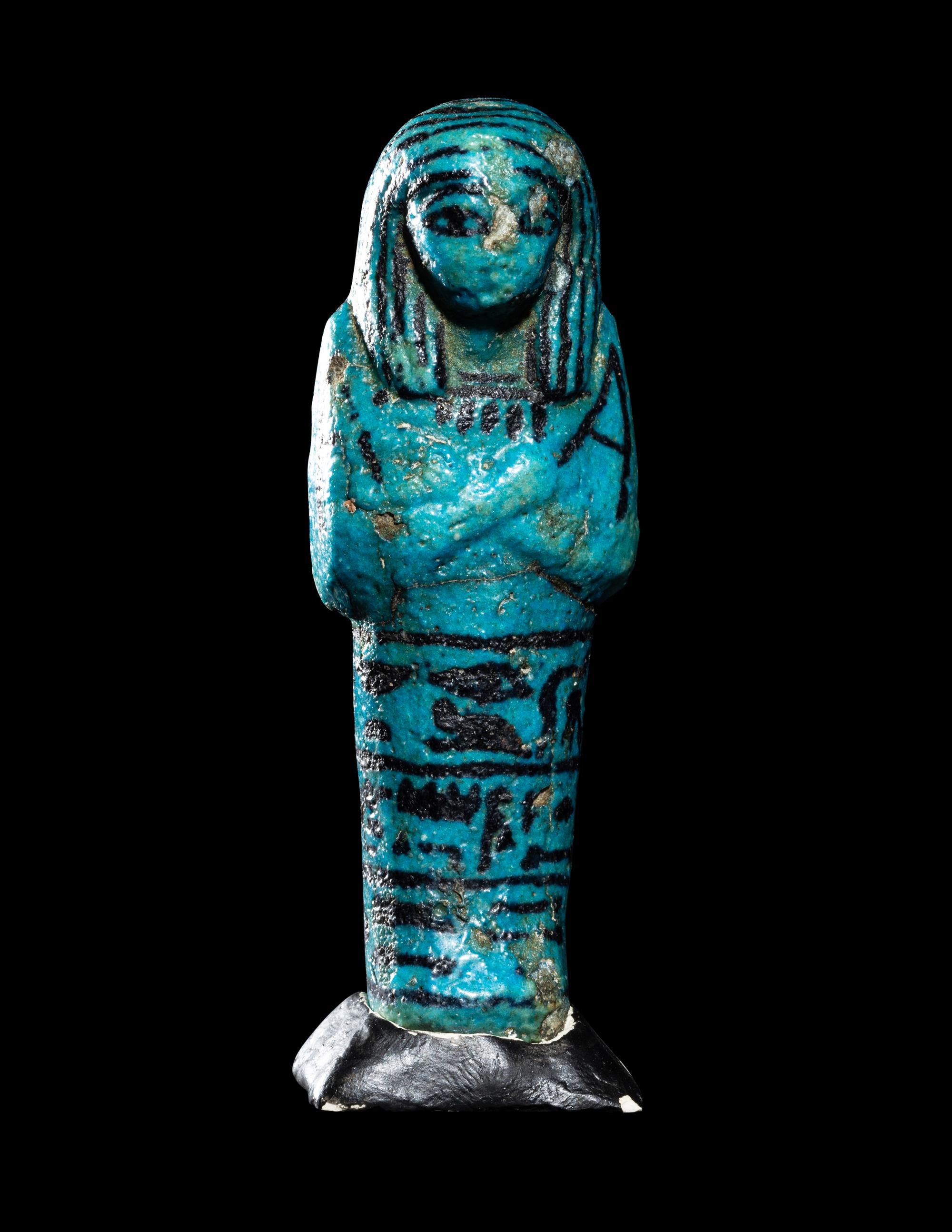 An Egyptian Blue Faience Ushabti for the Mistress of the House and Chantress of Amun, Muthotep