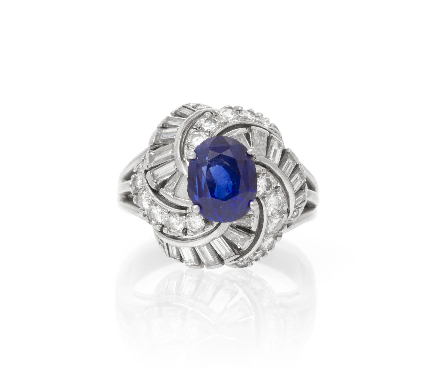 A Platinum, White Gold, Sapphire and Diamond Ring, 6.60 dwts.