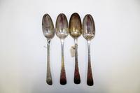A Set of Four Silver Table Spoons, Makers mark V&C, late 19th century, the handles with bright-cut geometric decoration.