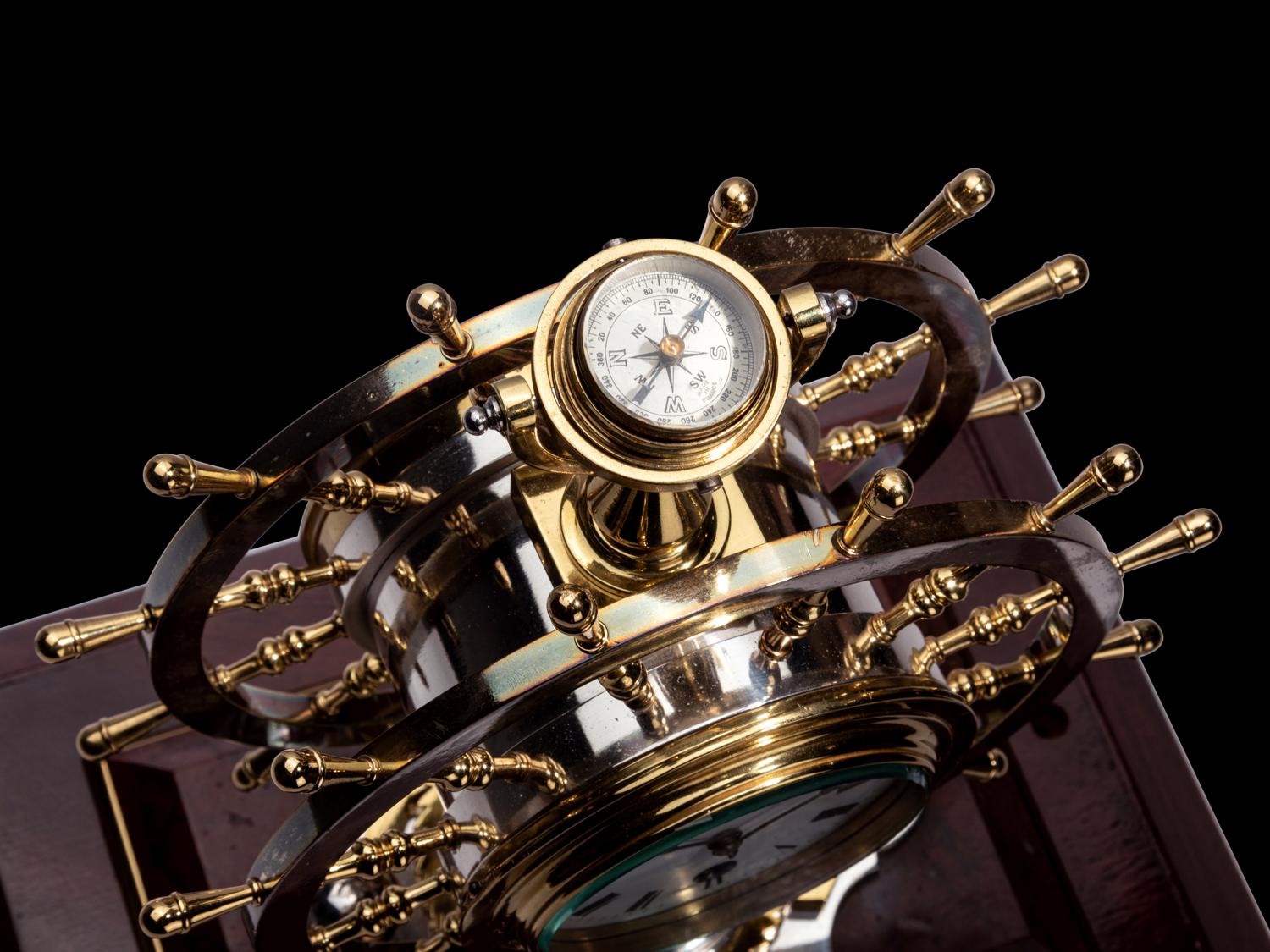 An English Steel and Brass Ship's Wheel Clock and Barometer, E&E Emanuel