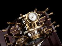 An English Steel and Brass Ship's Wheel Clock and Barometer, E&E Emanuel