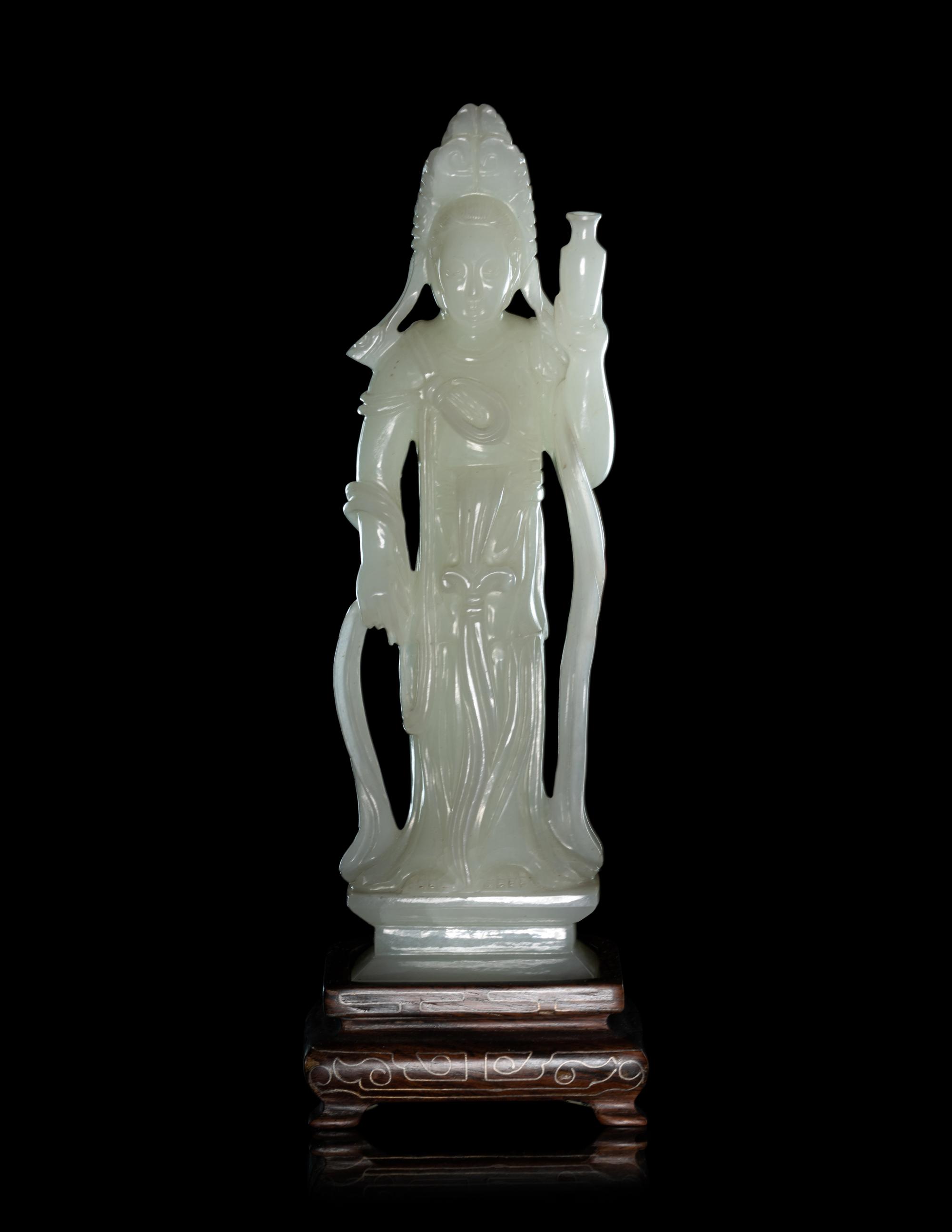 A Pale Celadon Jade Figure of Standing Guanyin