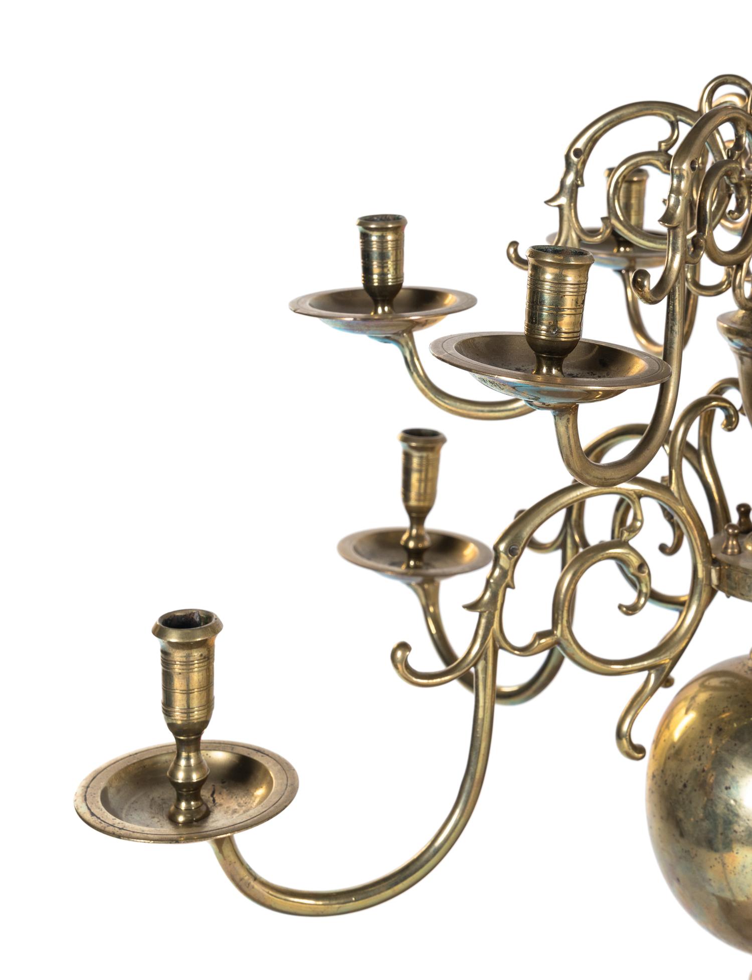 A Dutch Baroque Style Brass Twelve-Light Chandelier