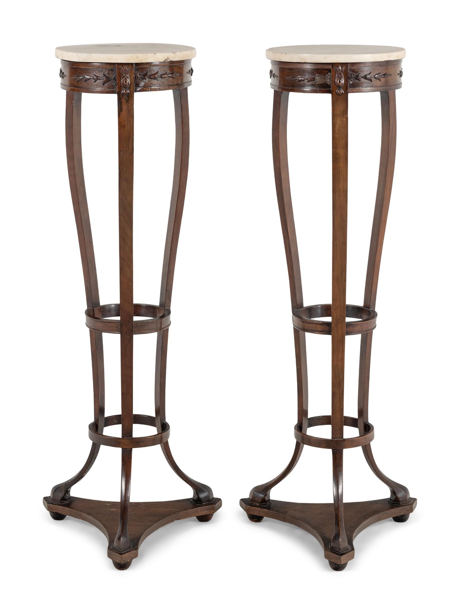 A Pair of Continental Mahogany Pedestal Stands