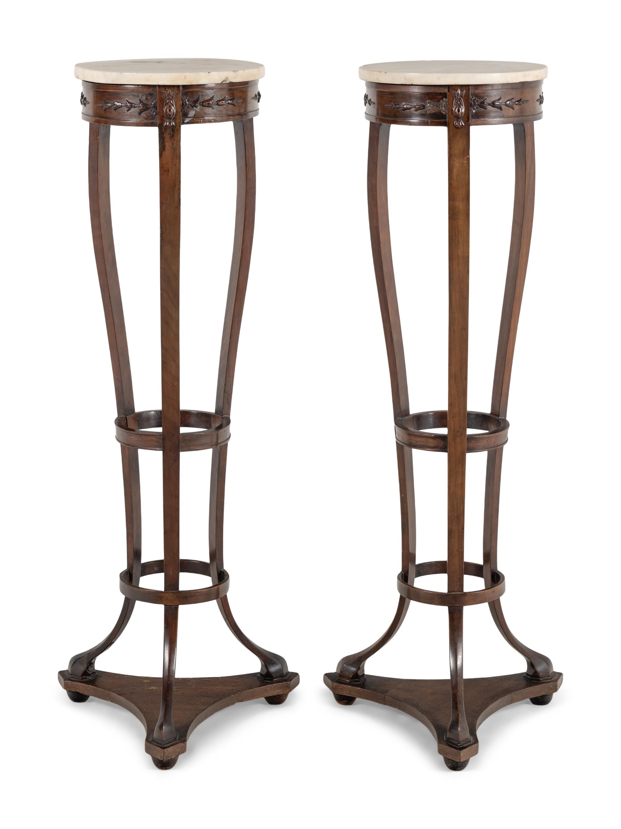 A Pair of Continental Mahogany Pedestal Stands