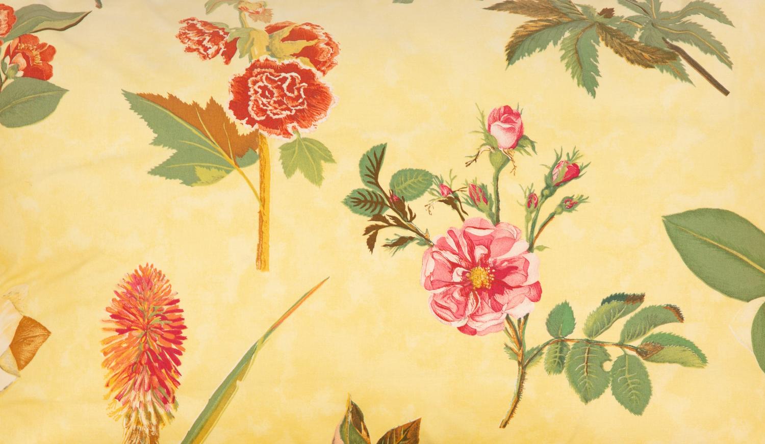 A Yellow Floral Chintz Upholstered Sofa and a Pair of Matching Drapes
