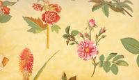 A Yellow Floral Chintz Upholstered Sofa and a Pair of Matching Drapes
