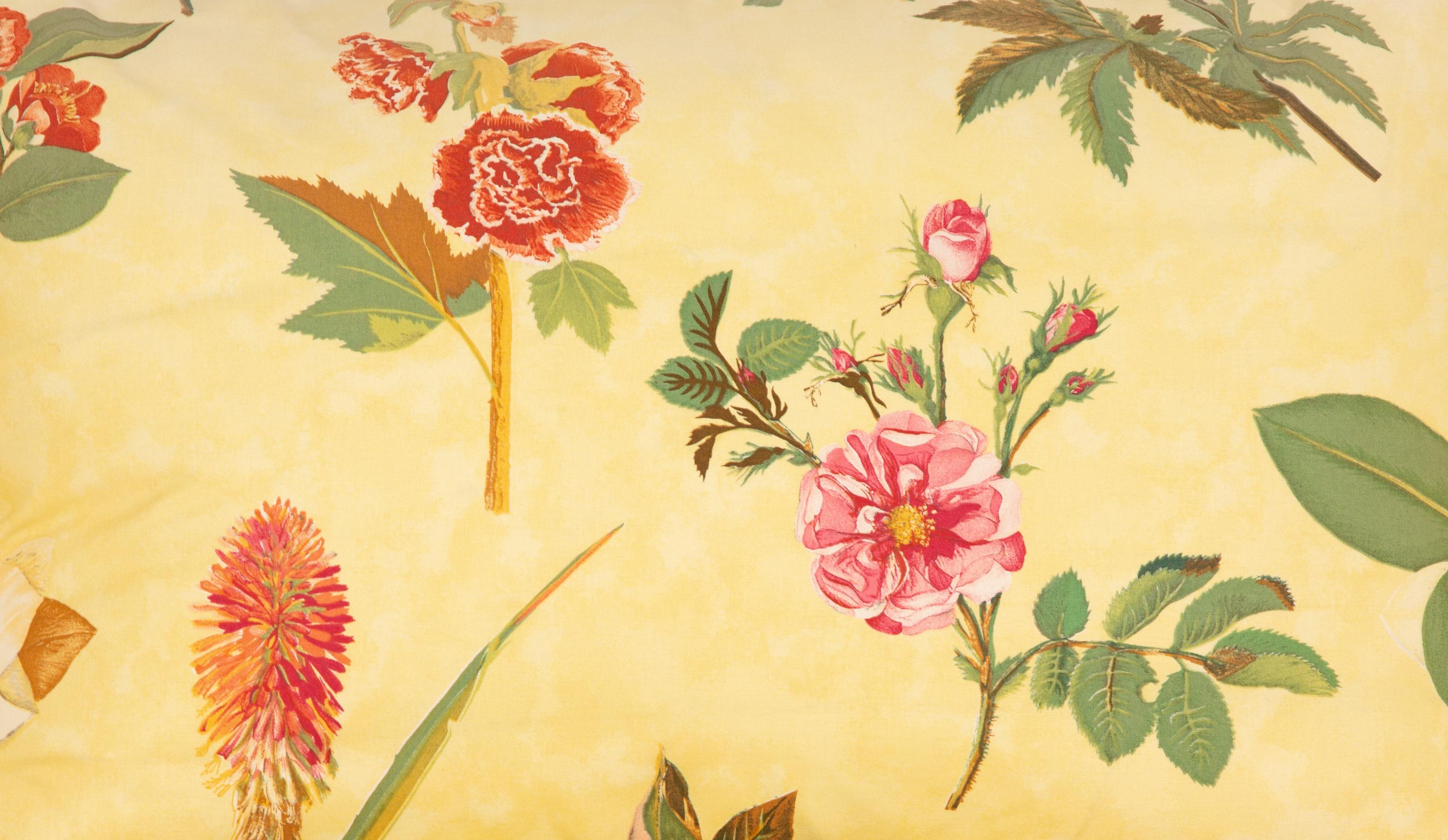 A Yellow Floral Chintz Upholstered Sofa and a Pair of Matching Drapes