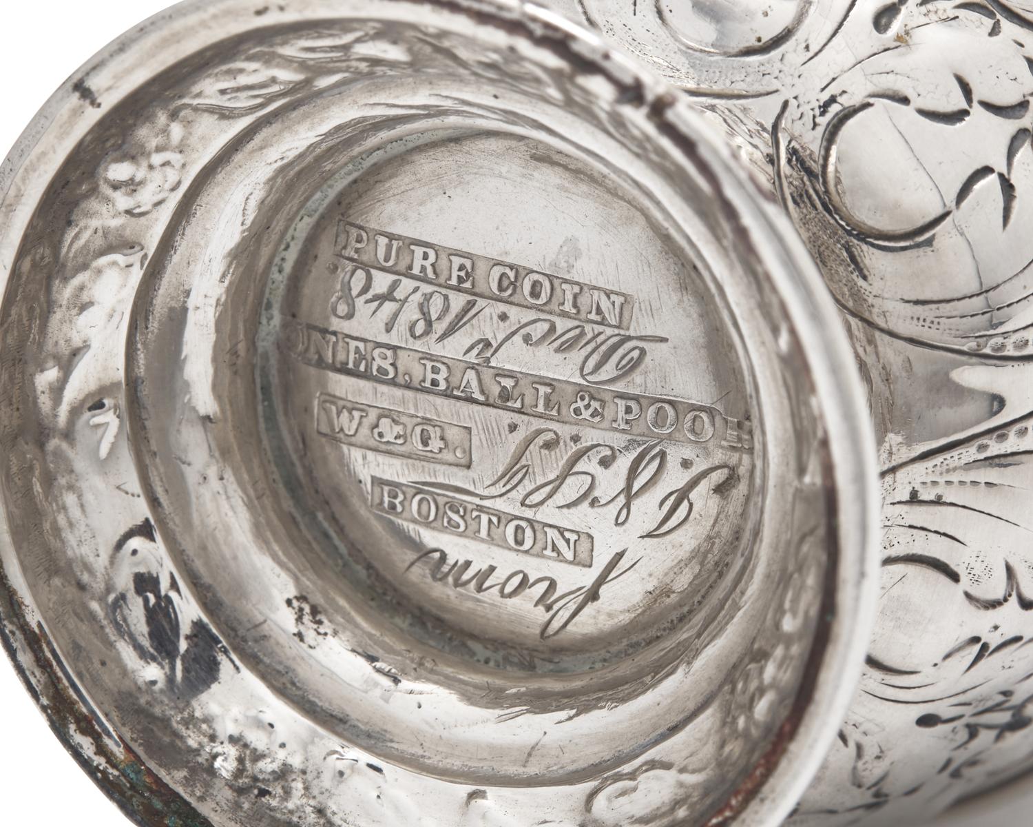 A Pair of Repousse Coin Silver Casters