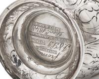 A Pair of Repousse Coin Silver Casters