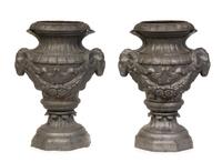 A Pair of Neoclassical Cast Metal Garden Urns Height 34 inches.