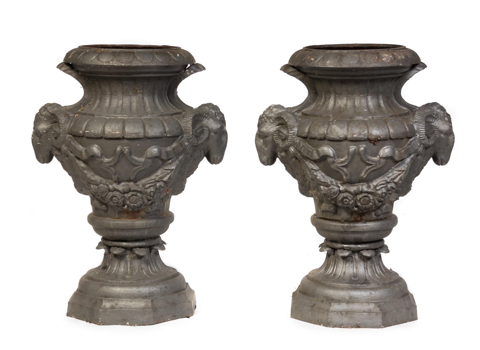 A Pair of Neoclassical Cast Metal Garden Urns Height 34 inches.