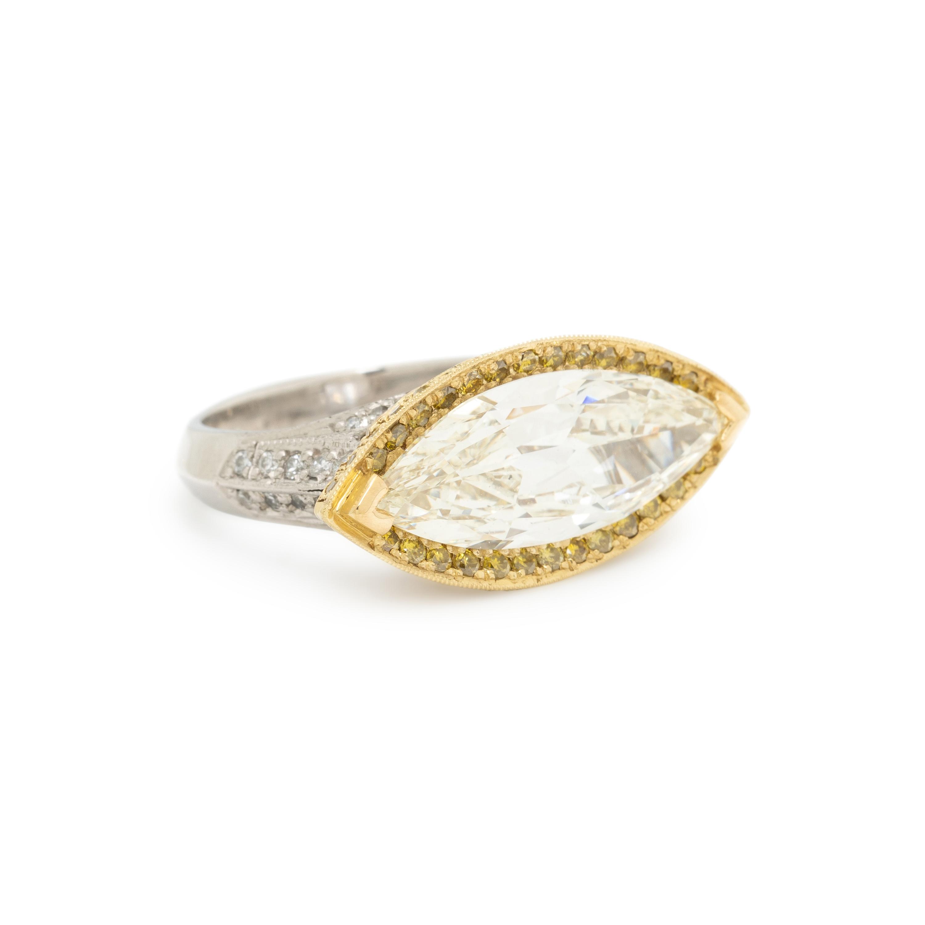EAST-WEST MARQUISE CUT DIAMOND AND YELLOW DIAMOND RING