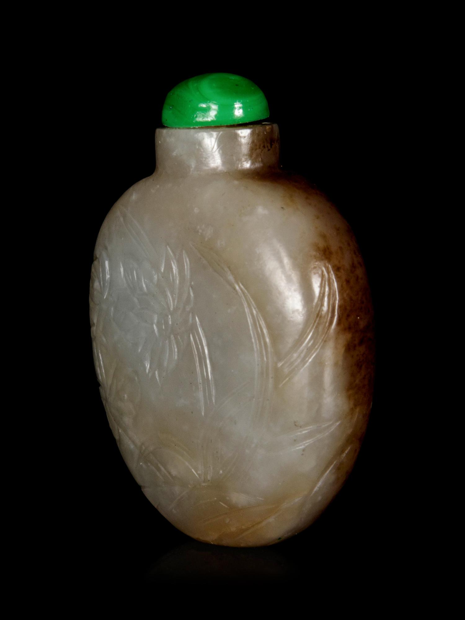 A Chinese Russet and Celadon Jade ‘Floral’ Snuff Bottle