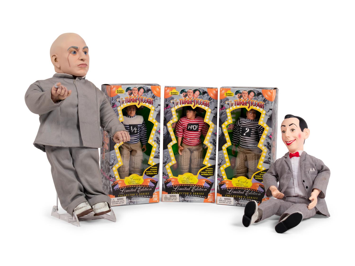 (Film Memorabilia) A group of 5 dolls from three comedies, comprising: