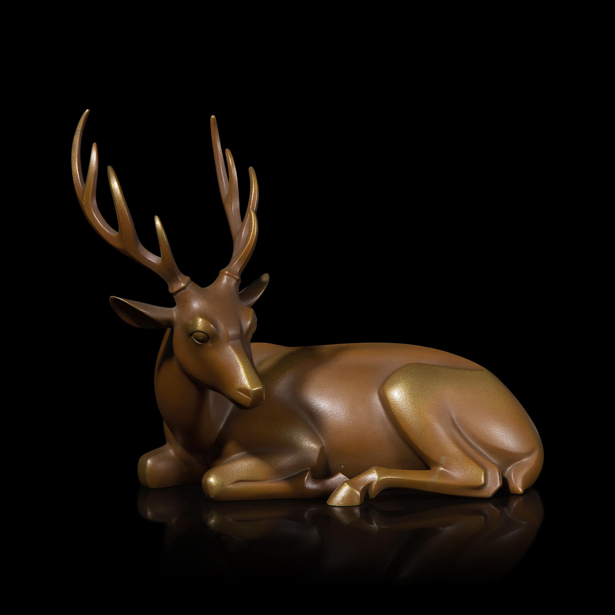 A Japanese Patinated Bronze Figure of a Recumbent Deer, Showa Period
