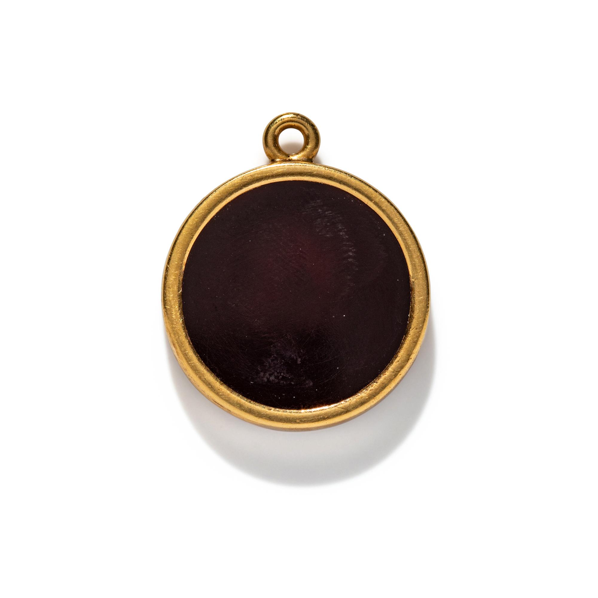 A Neoclassical Gold and Carnelian Pendant with a Portrait Head of Alexander the Great as Hercules