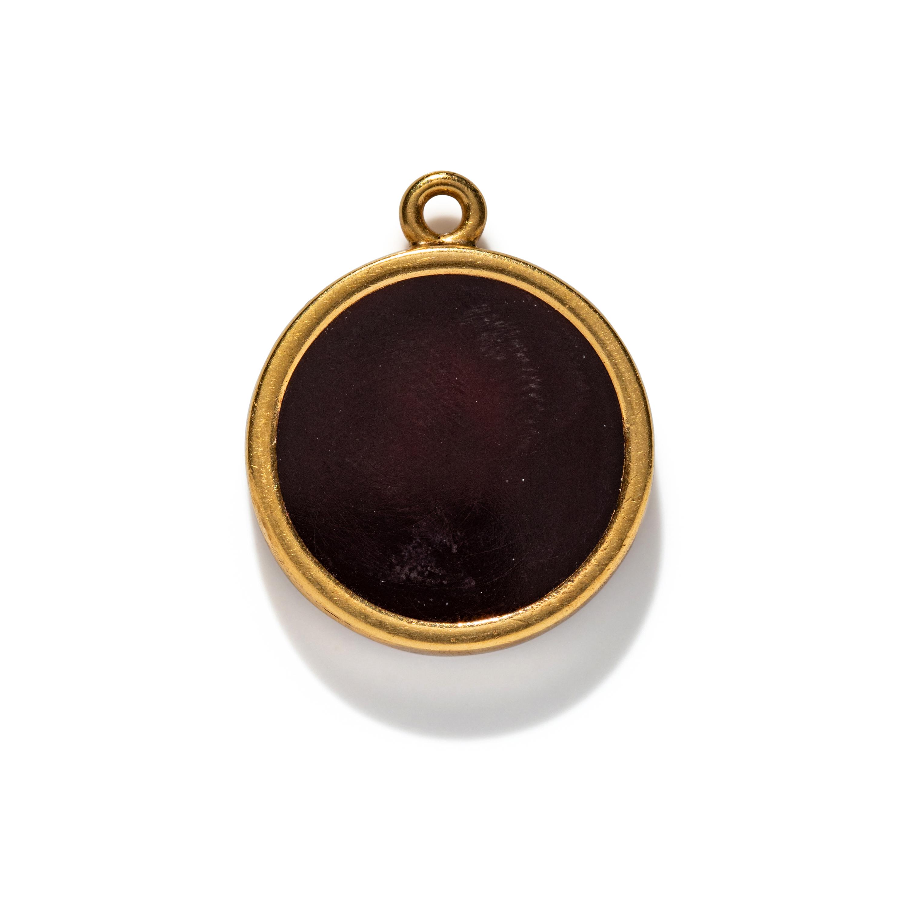A Neoclassical Gold and Carnelian Pendant with a Portrait Head of Alexander the Great as Hercules
