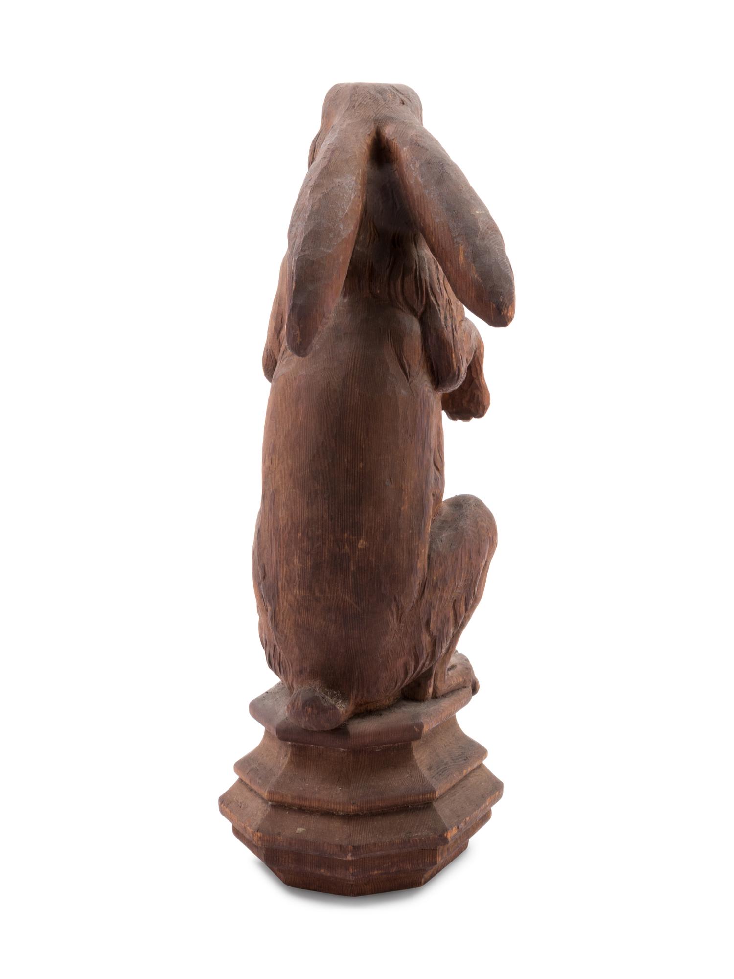A Continental Carved Pine Figure of a Rabbit
