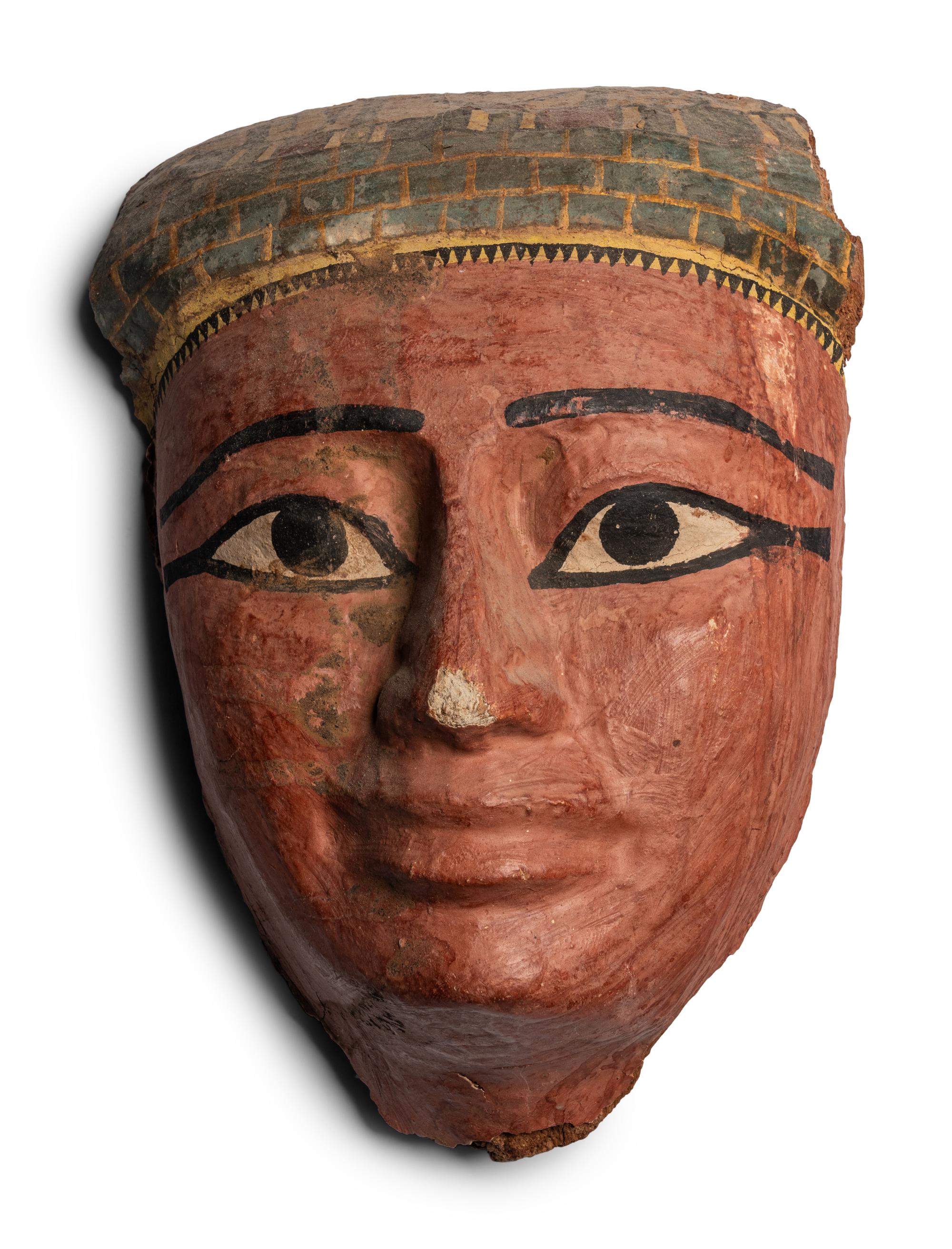 An Egyptian Wood and Painted Cartonnage Mummy Mask
