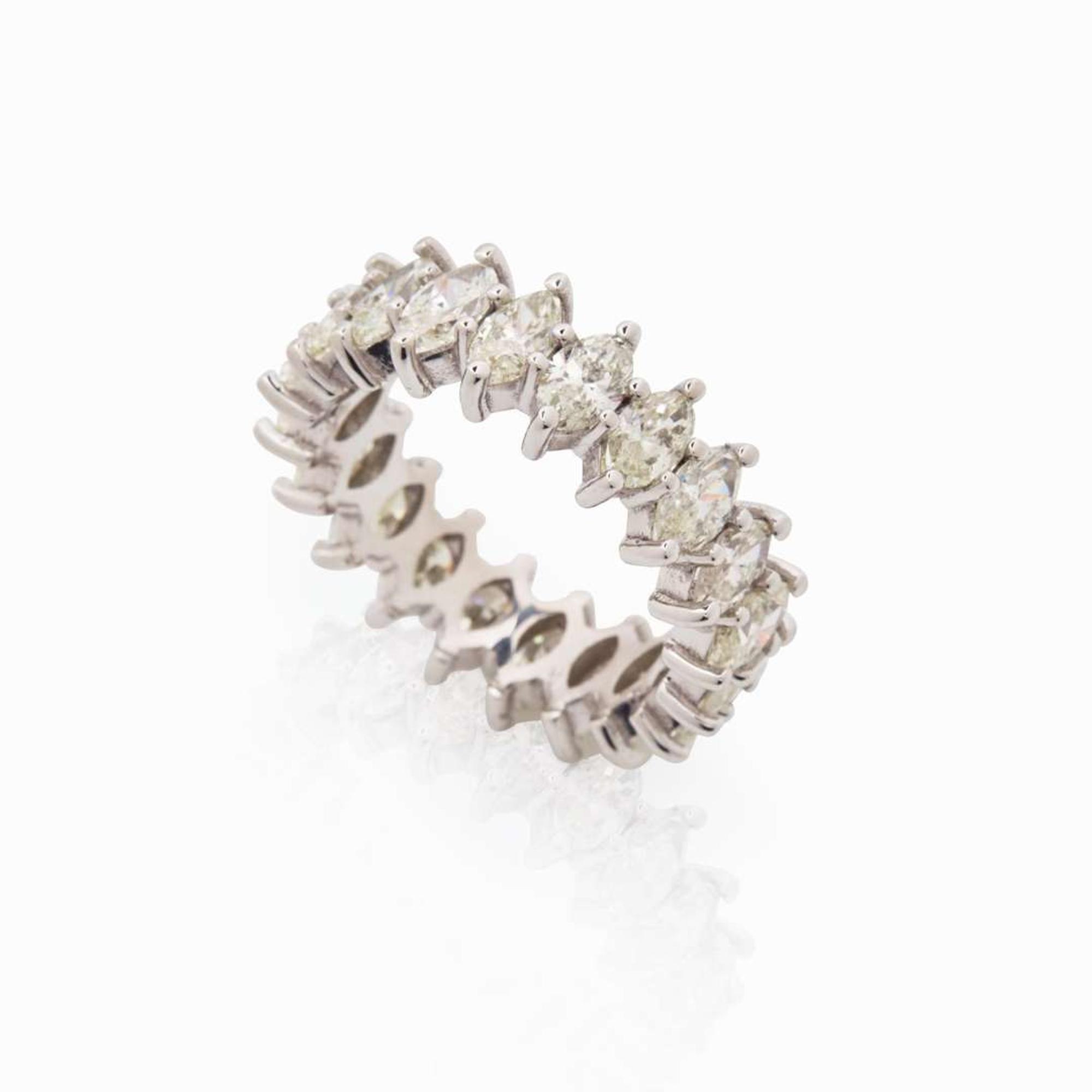 A Diamond and 18K White Gold Eternity Band