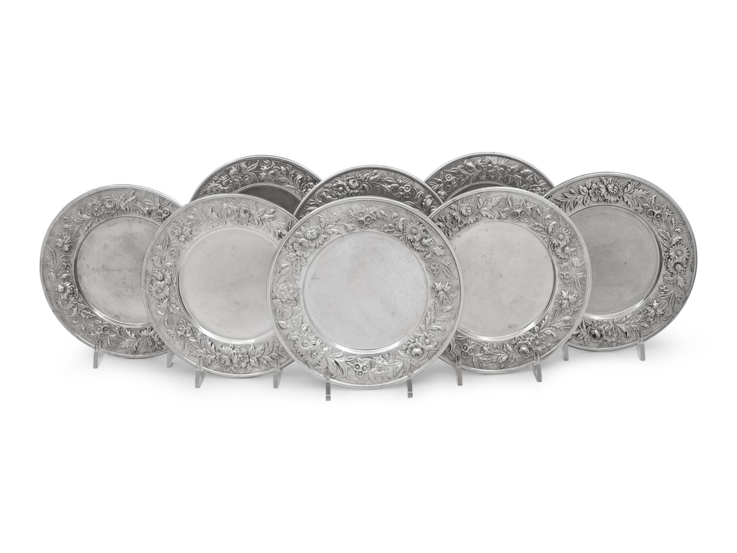 A Set of Eight S. Kirk and Son Repousse Silver Bread Plates