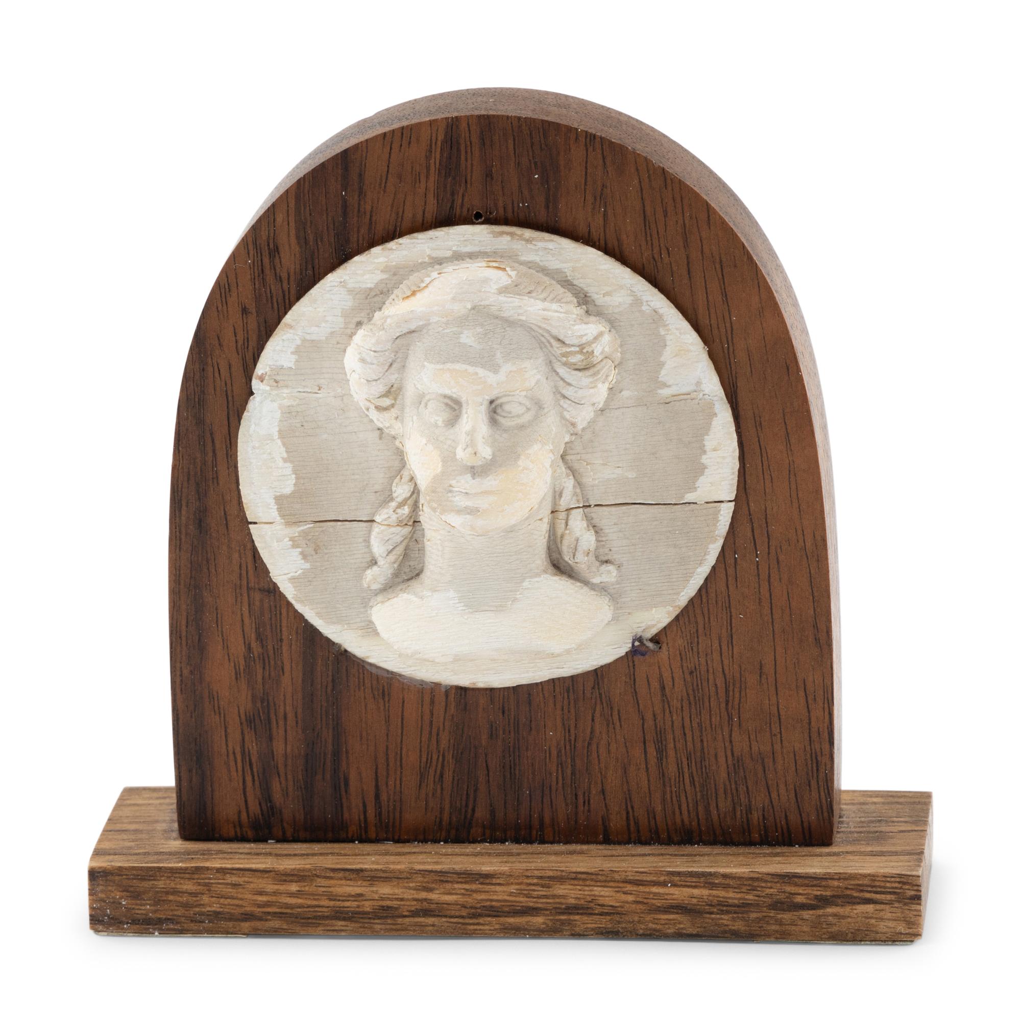 A White Painted Carved Wooden Portrait Relief of a Classical Female