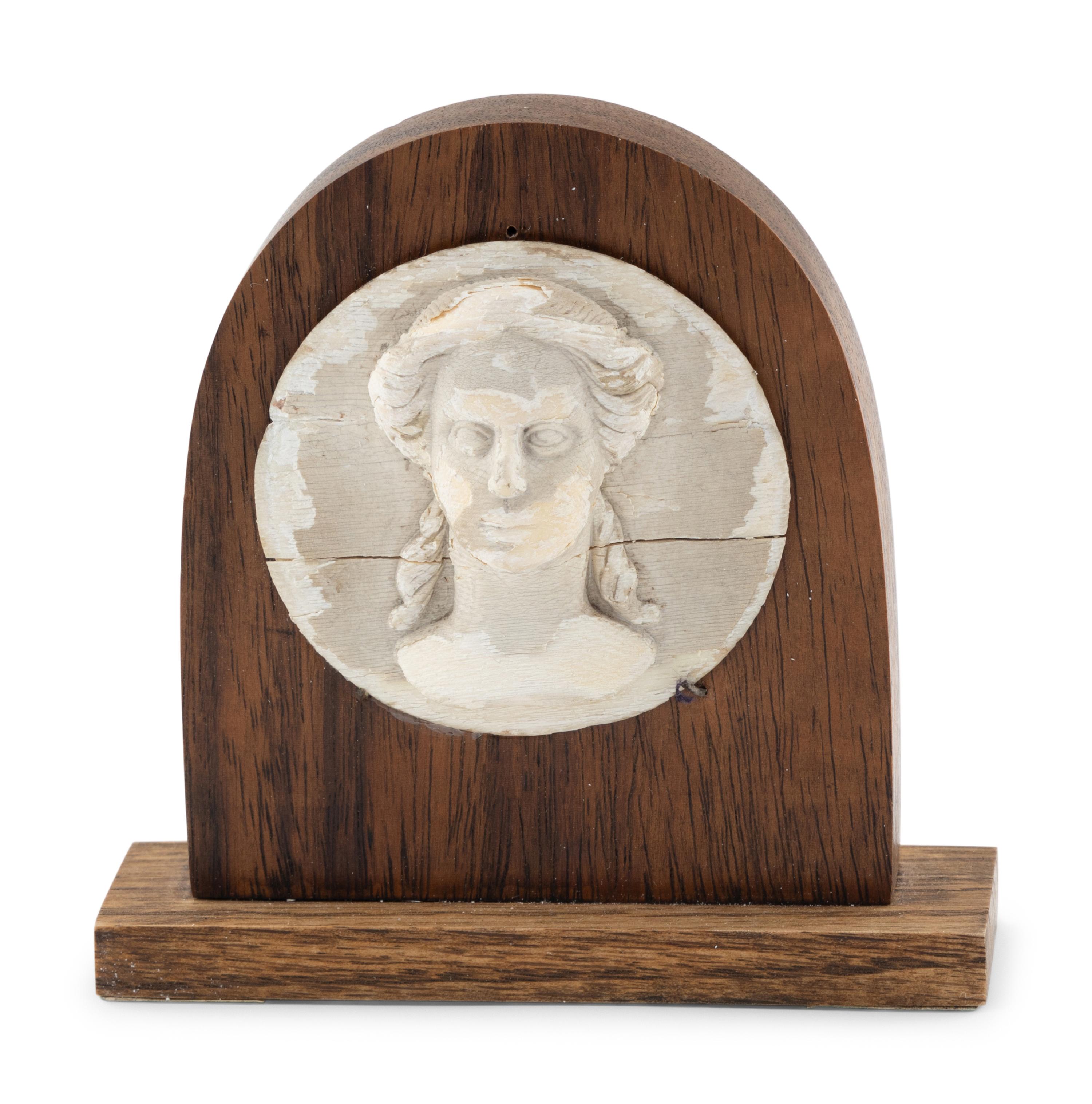 A White Painted Carved Wooden Portrait Relief of a Classical Female