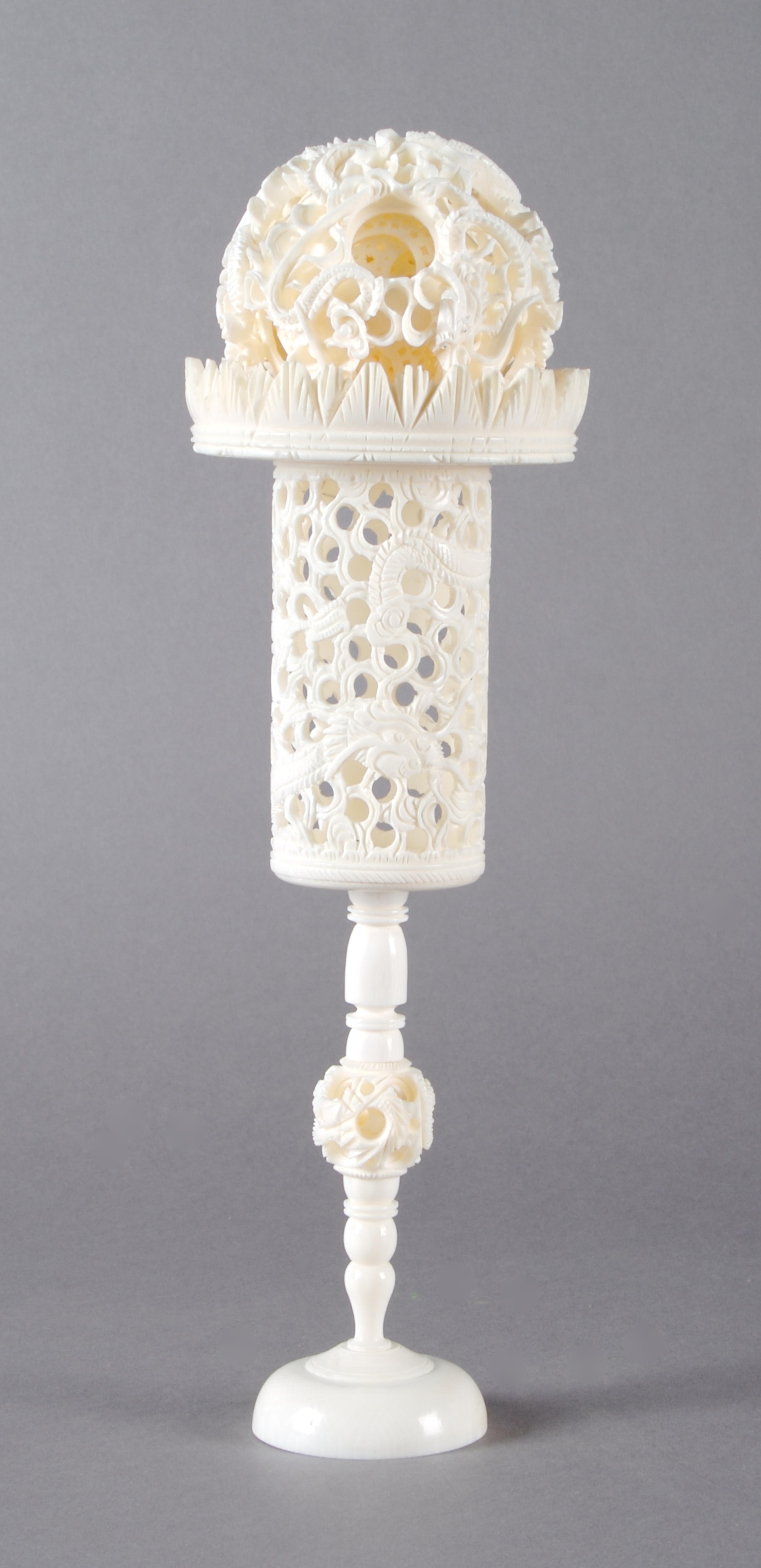A Chinese Carved Ivory Puzzle Ball, Height 11 1/4 inches.