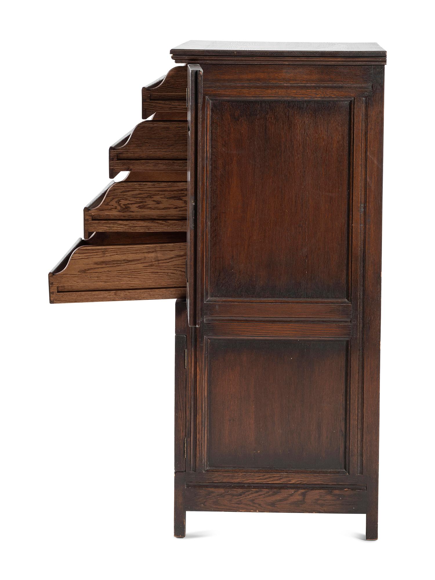 A Jacobean Style Carved Oak Cabinet