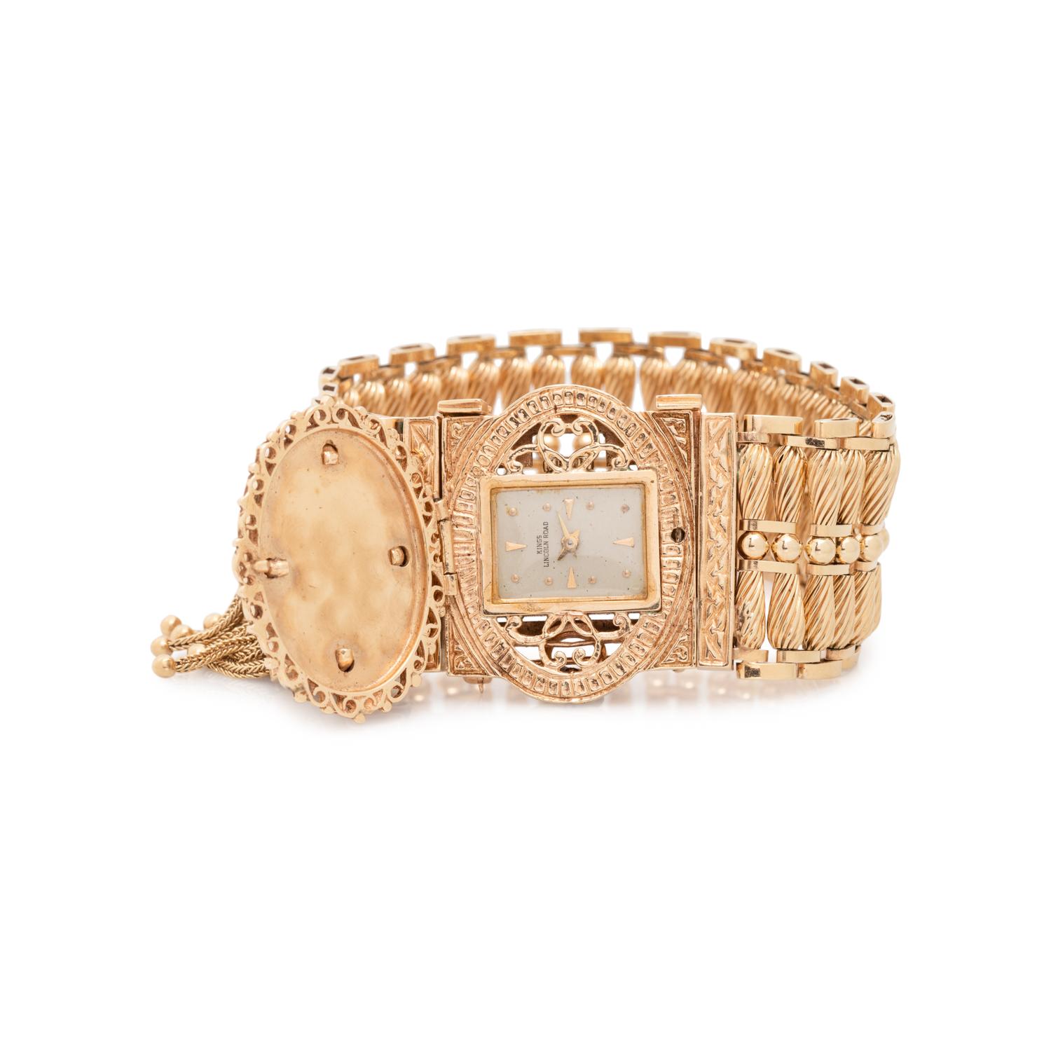 CONVERTIBLE YELLOW GOLD, ENAMEL AND SEED PEARL SURPRISE WRISTWATCH/PENDANT/BROOCH