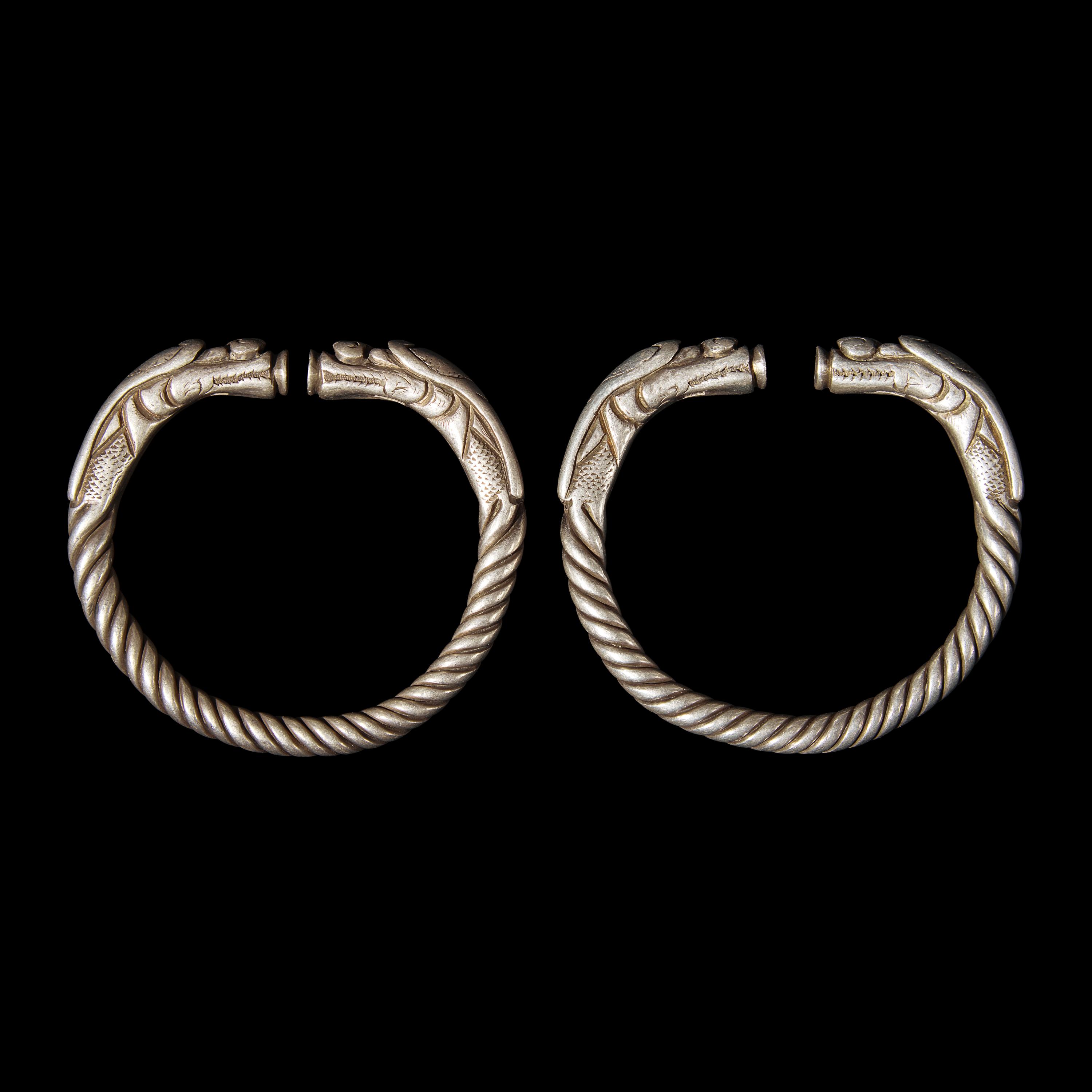 Six Chinese Silver 'Dragon' Bracelets, Qing Dynasty 清 銀龍頭紋鐲六隻